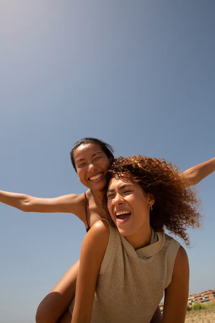 Two friends smiling during an outing